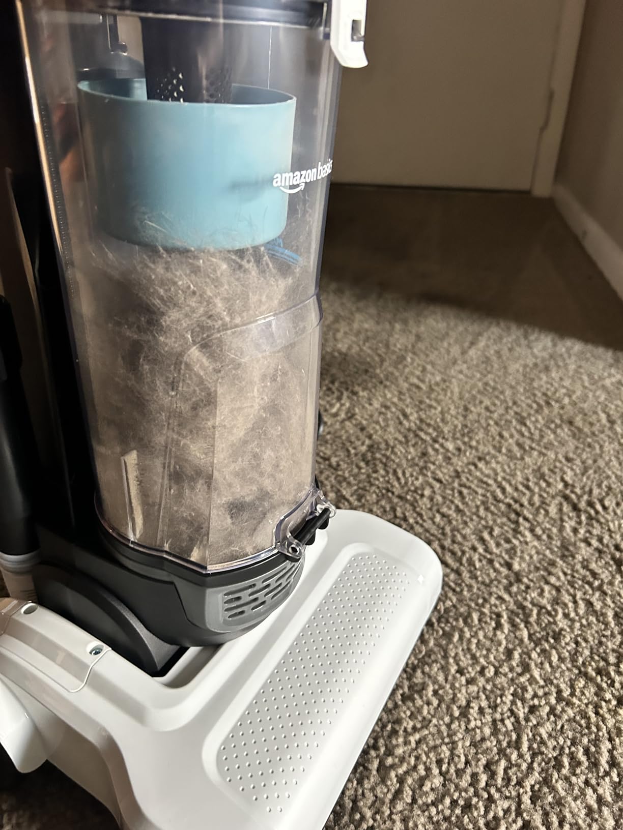 Amazon Basics Upright Bagless Vacuum Cleaner for Carpet and Hard Floors, With Crevice and Upholstery Tools, Detachable Handle, Lightweight (8.4 lbs), 1.7L Dust Cup, 720W, 25ft Cord, Black/White Customer Review Amazon Basics Upright Bagless Vacuum Cleaner for Carpet and Hard Floors, With Crevice and Upholstery Tools, Detachable Handle, Lightweight (8.4 lbs), 1.7L Dust Cup, 720W, 25ft Cord, Black/White - Customer Photo 1