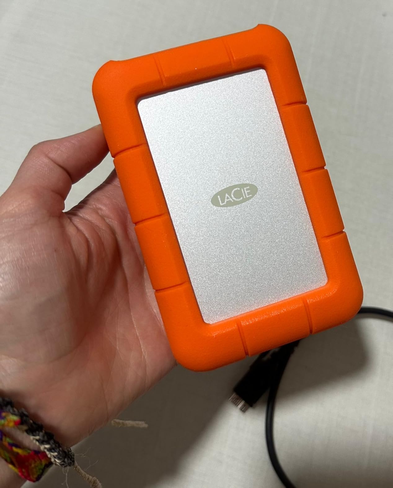 LaCie Rugged Mini 2TB External Hard Drive Portable HDD - USB 3.0/ 2.0 Compatible, Drop Shock Dust Rain Resistant Shuttle Drive, For Mac And PC Computer (LAC9000298), orange - Customer Photo 1