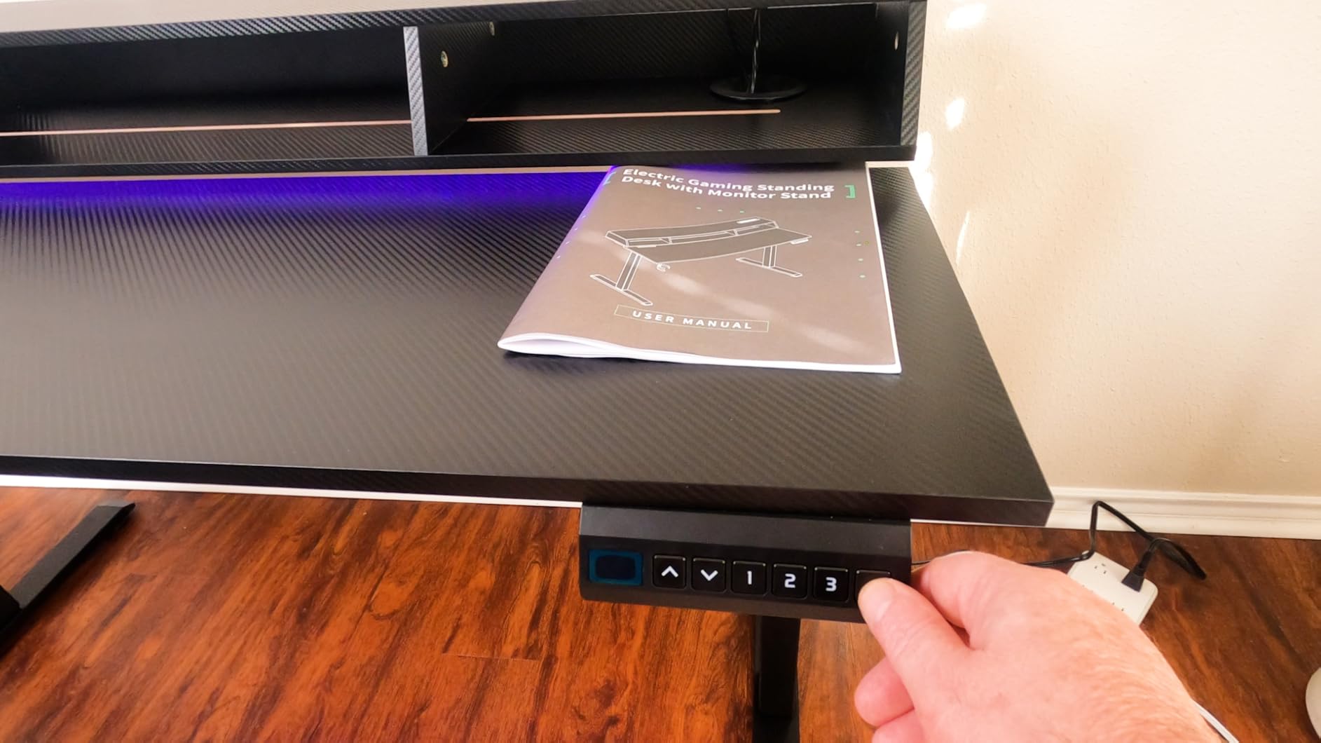 OffiGo Gaming Standing Desk with LED Light, 55 Inch Electric Height Adjustable Table with Power Outlet & Monitor Stand, Sit Stand Computer Workstation for Home, Bedroom, Black - Customer Photo 1