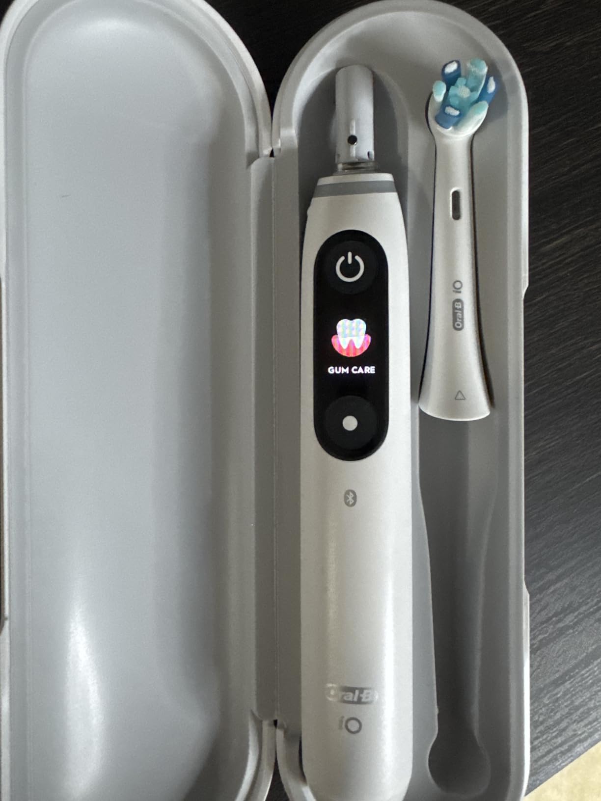 Oral-B iO Series 5 Rechargeable Electric Toothbrush with Visible Pressure Sensor to Protect Gums, 2 Minute Timer, 5 Cleaning Settings, 1 Replacement Toothbrush Heads, and Travel Case, White - Customer Photo 2