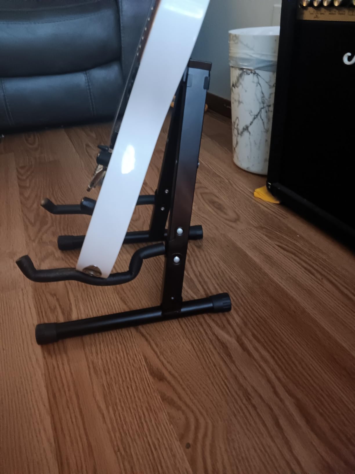 Amazon Basics Height Adjustable Foldable Guitar Stand with Secure Support for Acoustic, Electric, Bass and Banjos, Sturdy, Black - Customer Photo 1