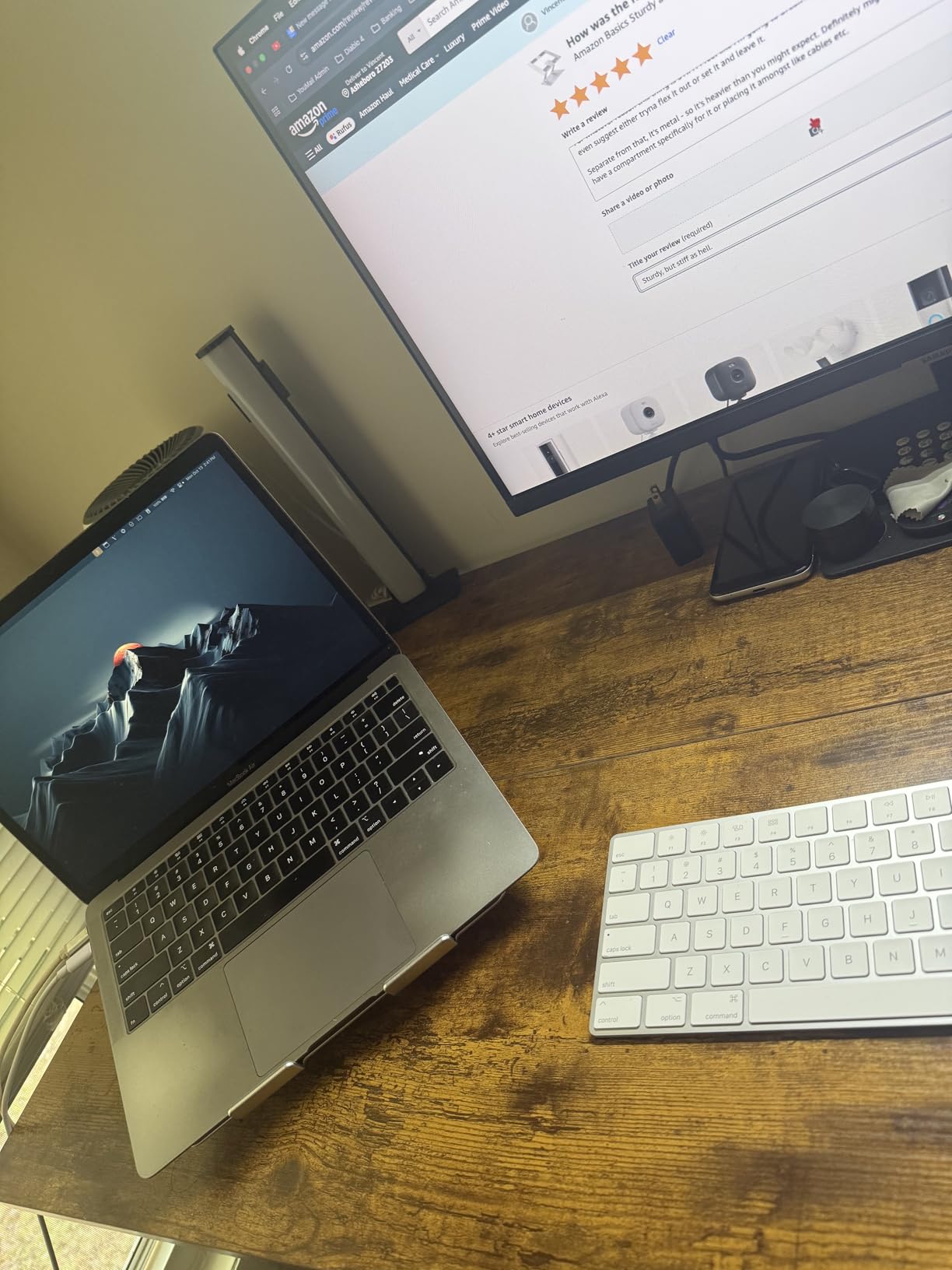 Amazon Basics Sturdy and Portable Ergonomic Laptop Stand for Desk, Height Adjustable Riser with Ventilated Cooling, Foldable, Fits all Laptops up to 17.3 Inch, Silver, 10 x 8.7 x 6 in customer photo 2