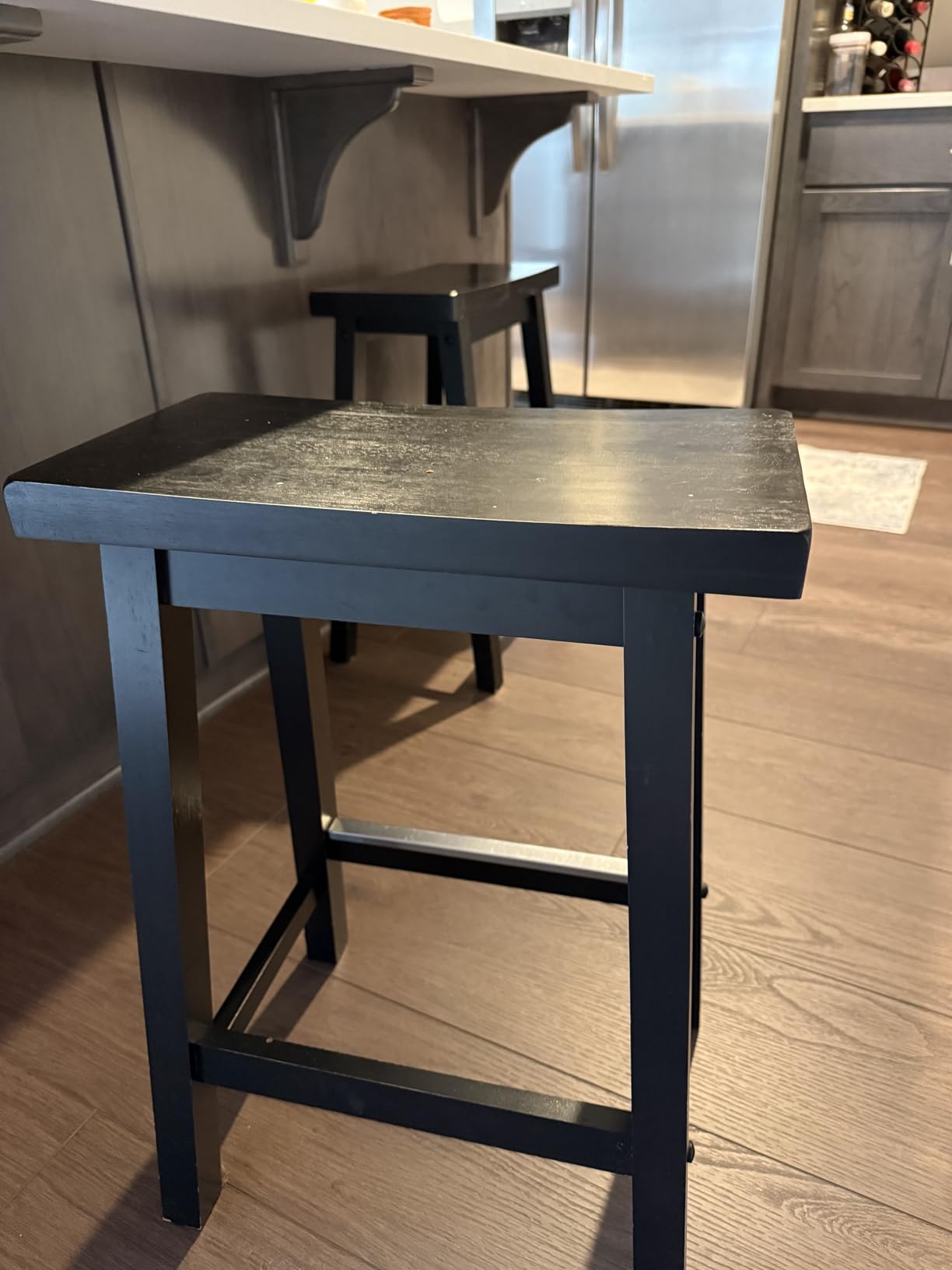 Amazon Basics Solid Wood Saddle-Seat Kitchen Counter Barstool with Footrest, Easy Assembly - 29-Inch Height - Walnut - Set of 2 - Customer Photo 1