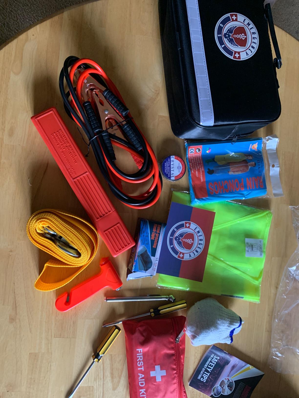 Roadside Car Emergency Kit - First Aid Set, Jumper Cables, Tow Strap, LED Flash Light, Rain Coat, Tire Pressure Gauge, Safety Vest and More (Black) customer photo 1
