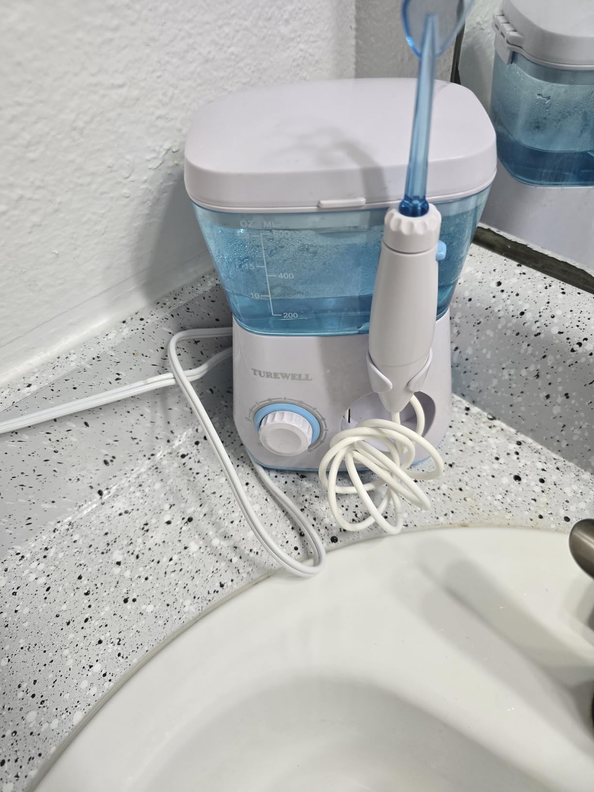 TUREWELL Water Flossing Oral Irrigator, 600ML Dental Cleaner 10 Adjustable Pressure, Electric Oral Flosser for Teeth/Braces, 8 Replacement Jet Tips for Family (White) customer photo 2