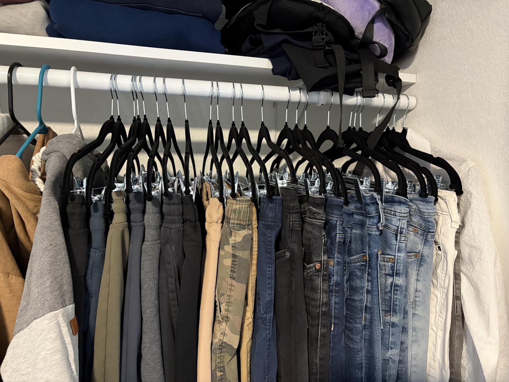 Amazon Basics Velvet Non-Slip Skirt Clothes Hangers with Clips, 360 Degree Rotatable Hook, Organize Pants and Skirts, Black/Silver, 24-Pack customer photo 1