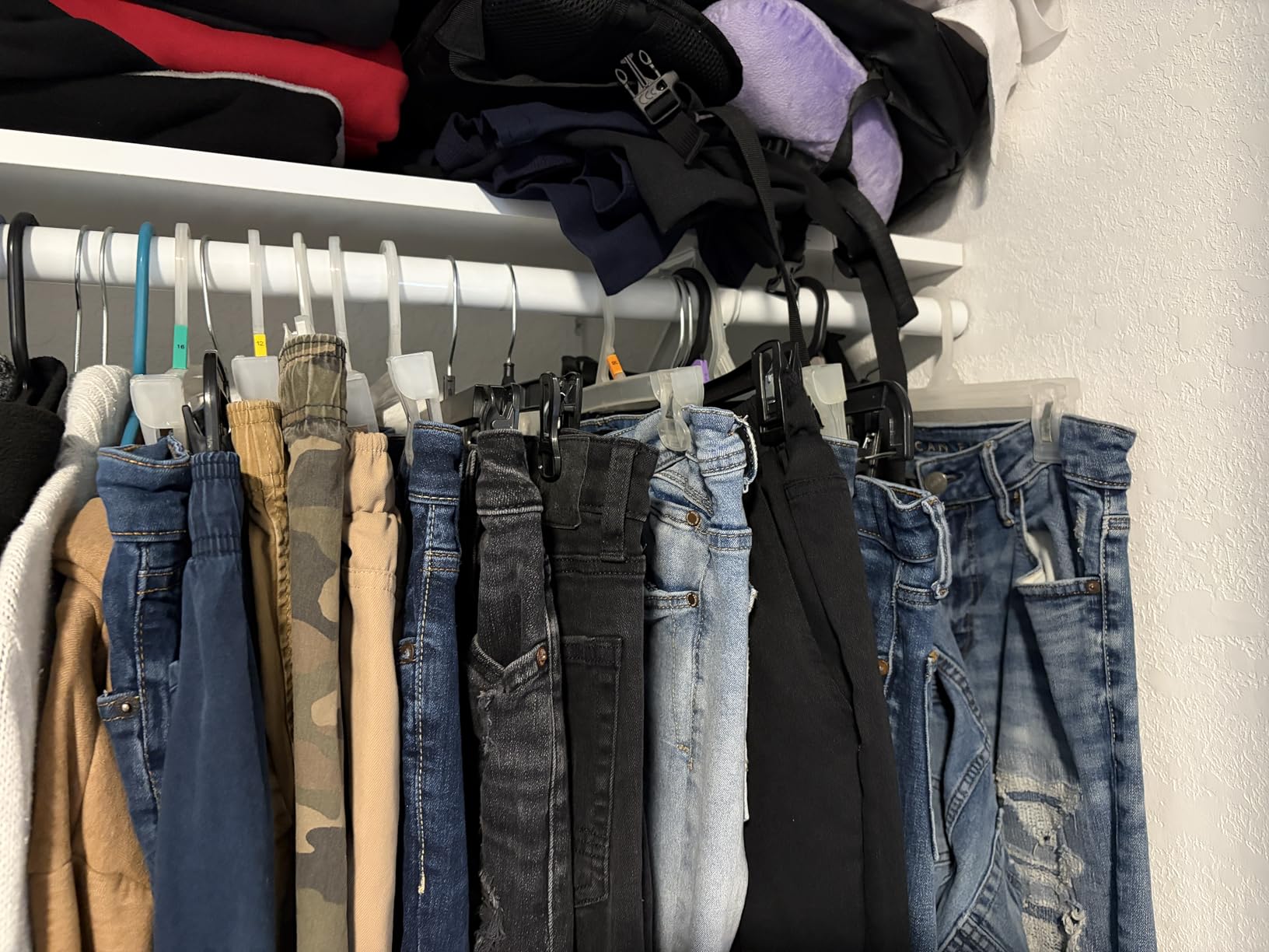 Amazon Basics Velvet Non-Slip Skirt Clothes Hangers with Clips, 360 Degree Rotatable Hook, Organize Pants and Skirts, Black/Silver, 24-Pack customer photo 2