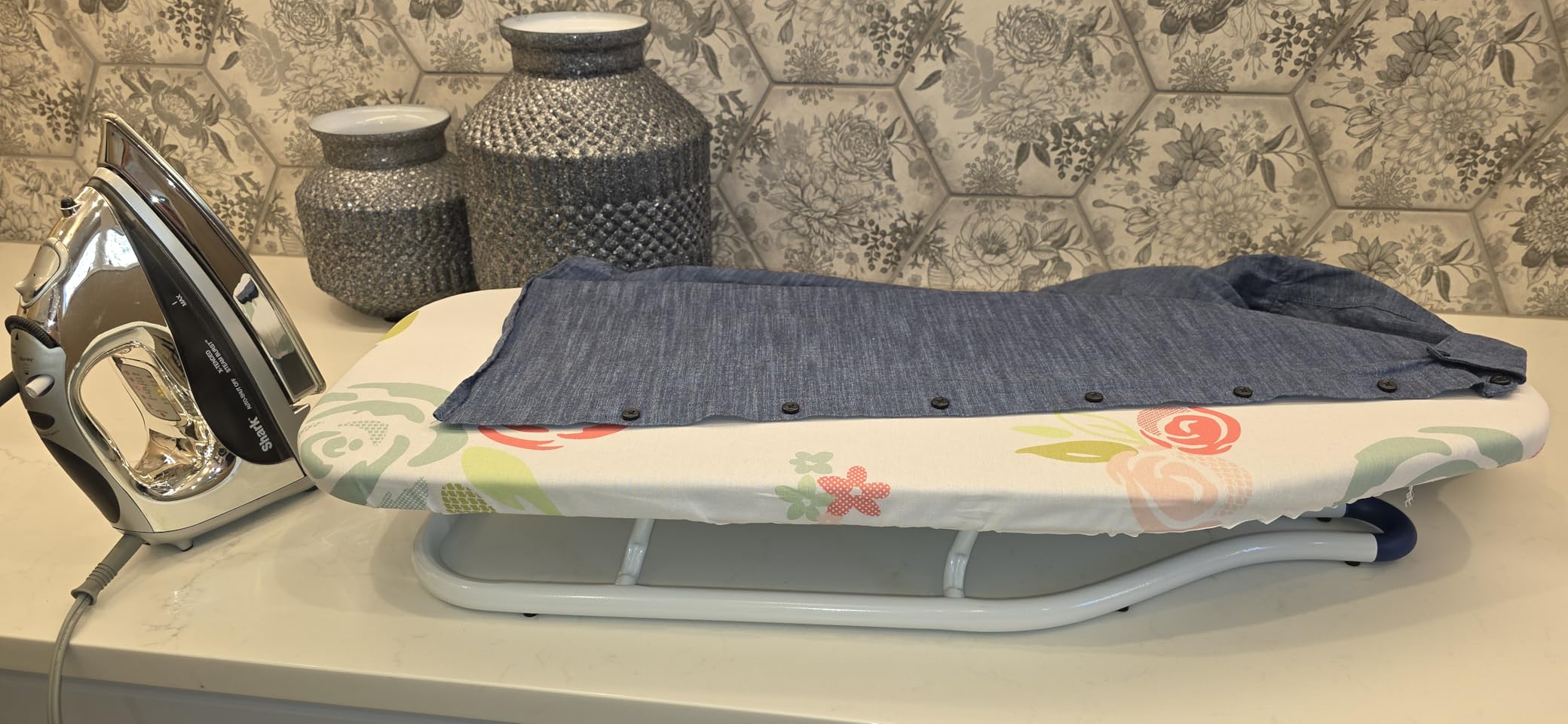 Amazon Basics Foldable Space Saving Ironing Board Tabletop with Non-Slip Feet, 77x29 cm, White, Floral customer photo 1