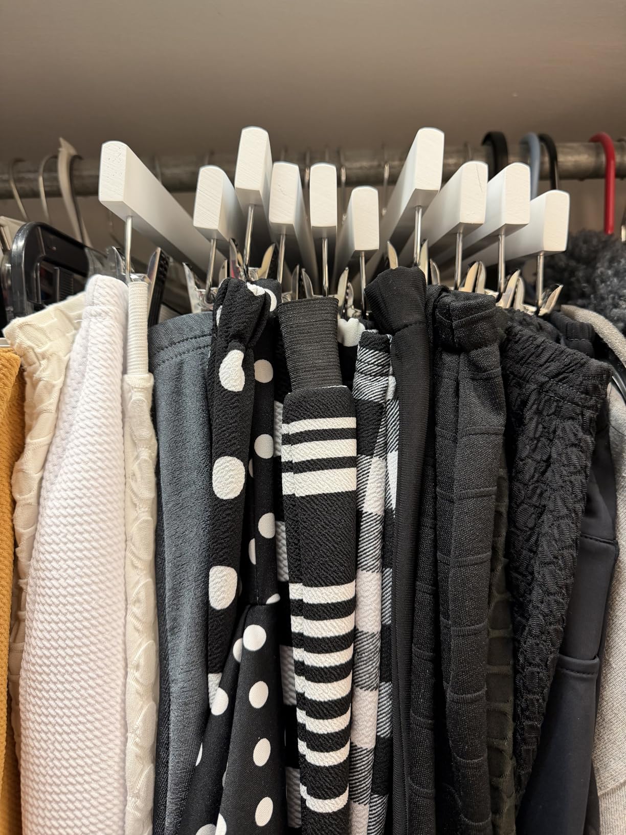 Amazon Basics Durable Wooden Pants and Skirt Hangers with Clips, Closet Organizer, White, 10-Pack customer photo 1