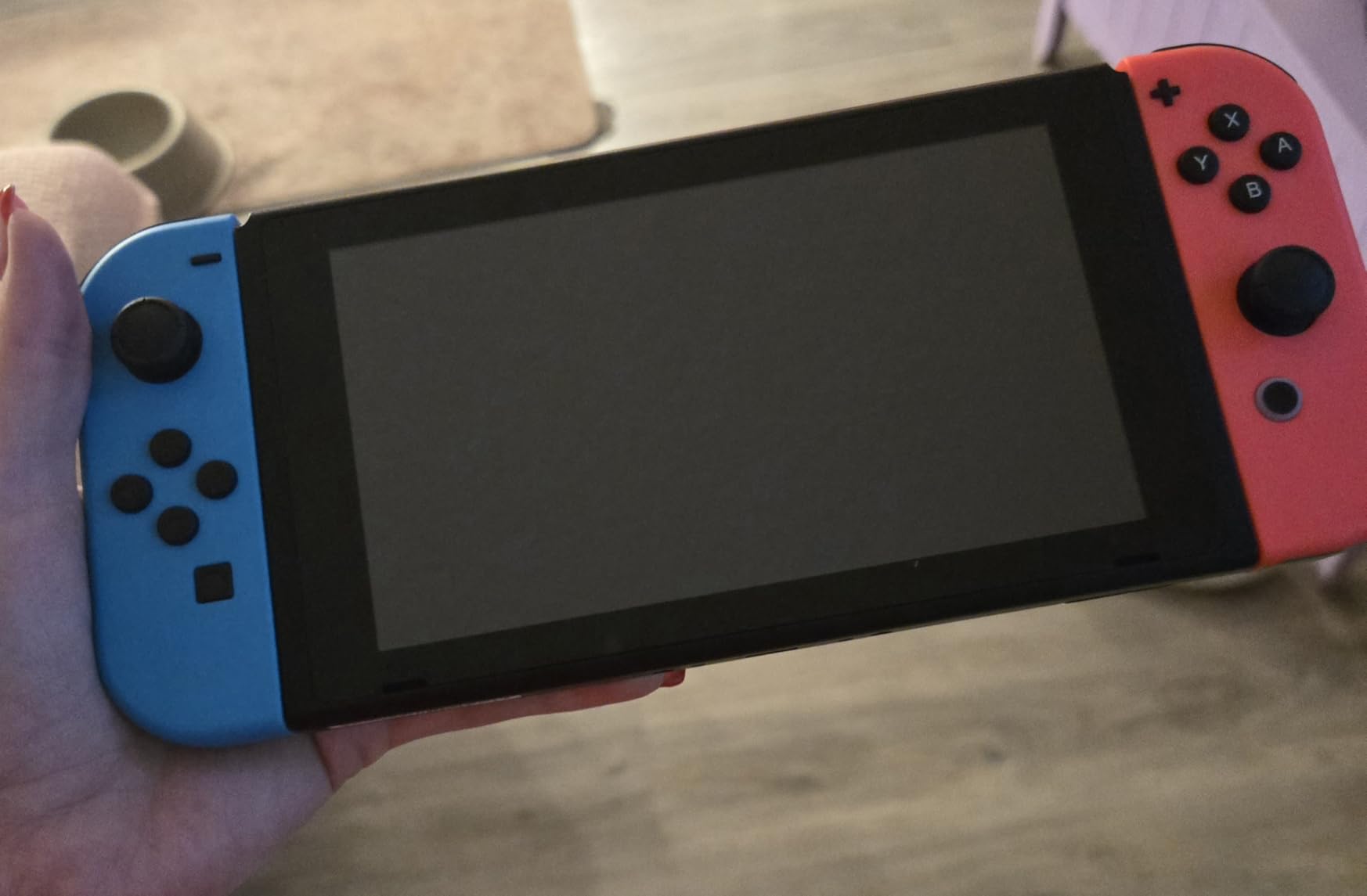 Nintendo Switch with Neon Blue and Red Joy-Con (Renewed) customer photo 1