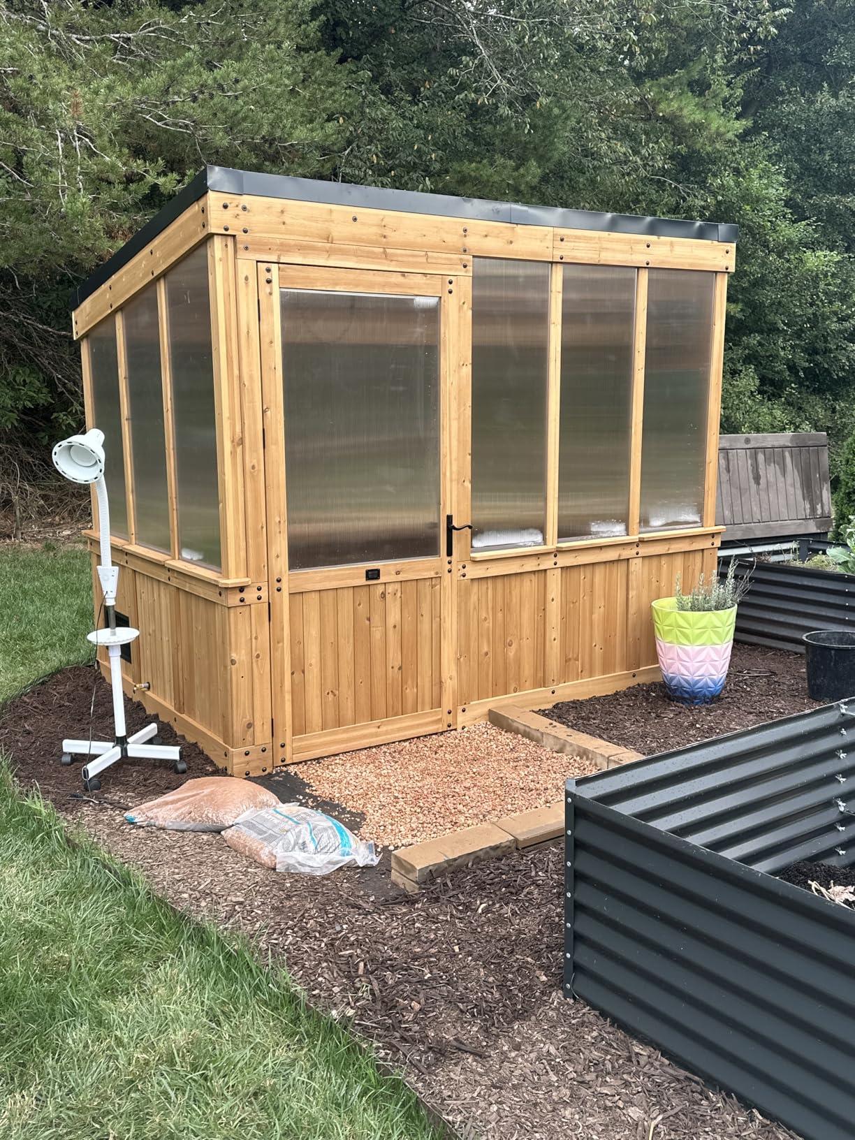 Backyard Discovery Willow 9' x 6' Cedar Wood and Polycarbonate Walk-in Greenhouse Kit with Exhaust Fan, Windows, Hose Hook-Ups, PowerPort, Staging Shelves for Year-Round Outdoor Gardening customer photo 1