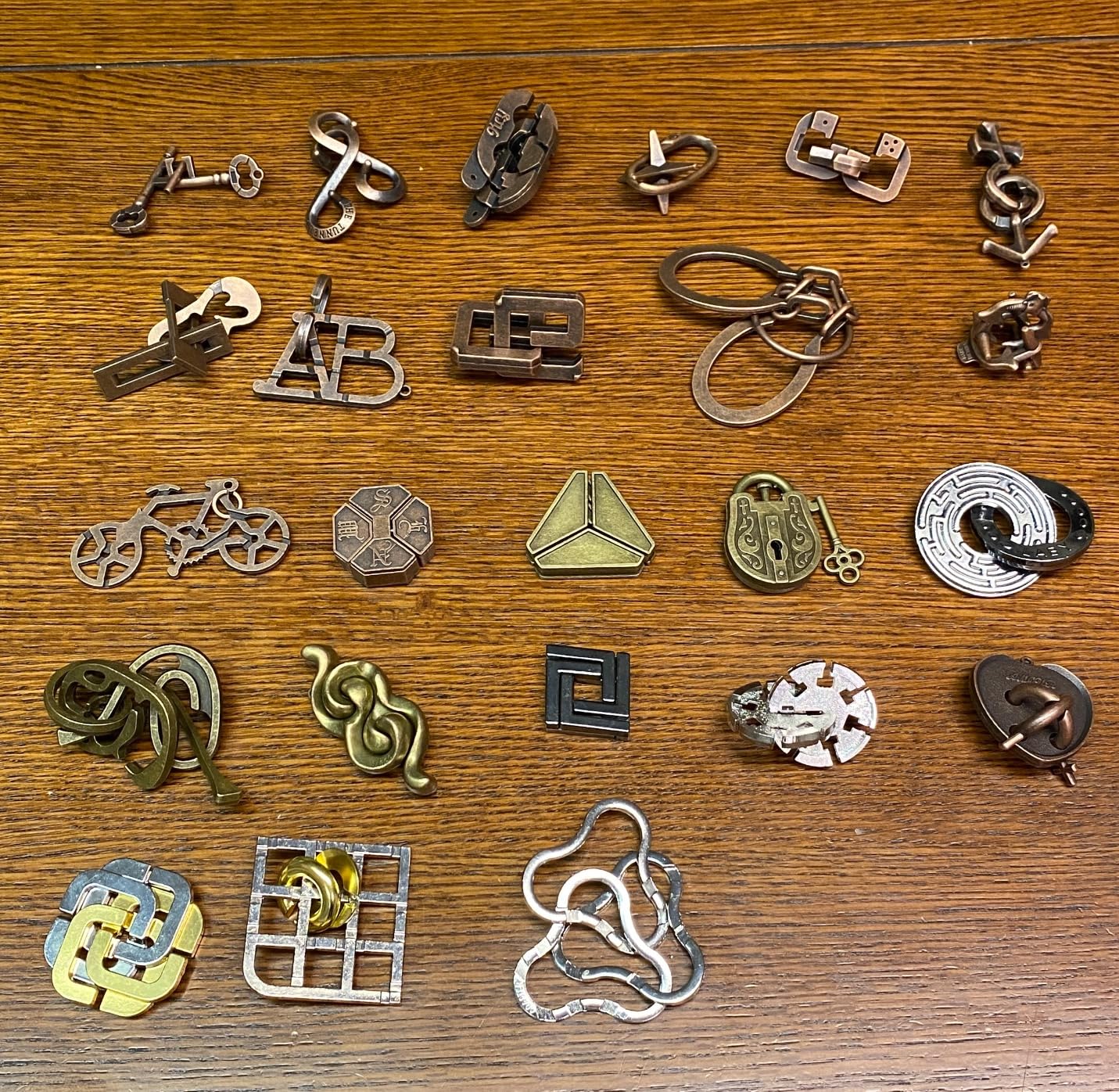 Yilloog 24 Pcs Metal Brain Teaser Puzzles Assortment for Adults Difficult Magic Puzzles Highly Hard Brain Games Iq Logic Test Disentanglement Game for Mind Challenge(Novelty) customer photo 1