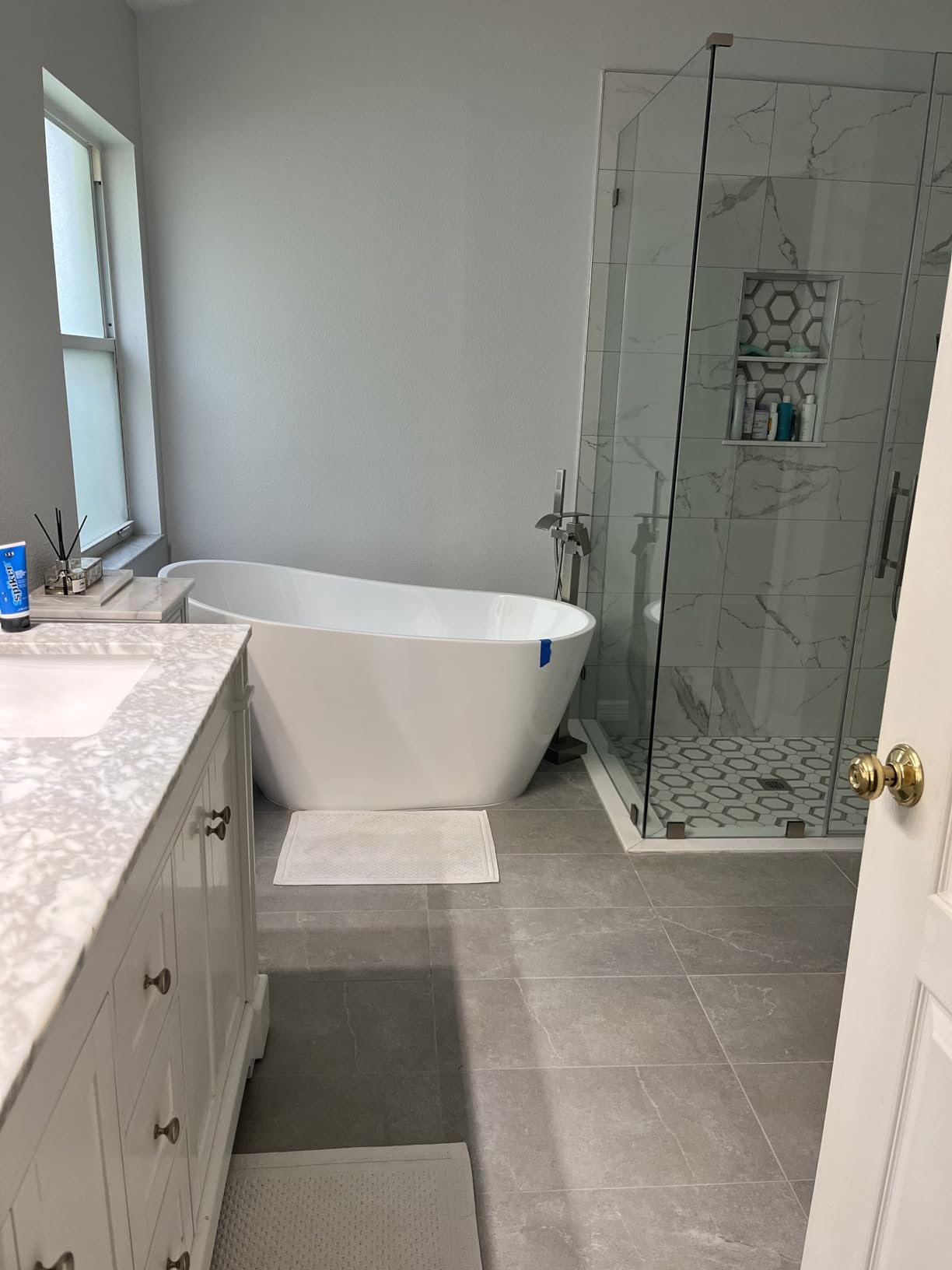 63 Inch Solid Surface Freestanding Bathtub, Oval Shaped Soaking Stone Resin Bath Tub with Brushed Overflow and Drain, Matte White Stand Alone Bathtub, cUPC Certified customer photo 1