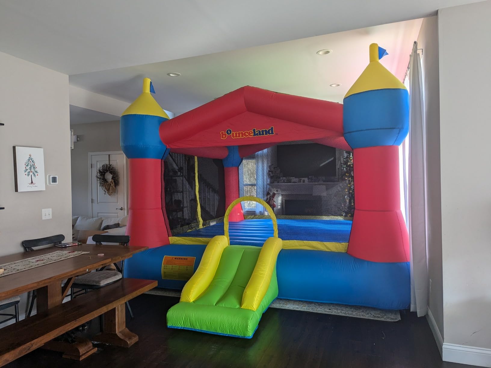 Bounceland Inflatable Party Castle Bounce House Bouncer, 16 ft L x 13 ft W x 10.3 ft H, Basketball Hoop, Removable Sun Roof, UL Strong Blower included, Fun Slide and Bounce Area, Castle Theme for Kids customer photo 1