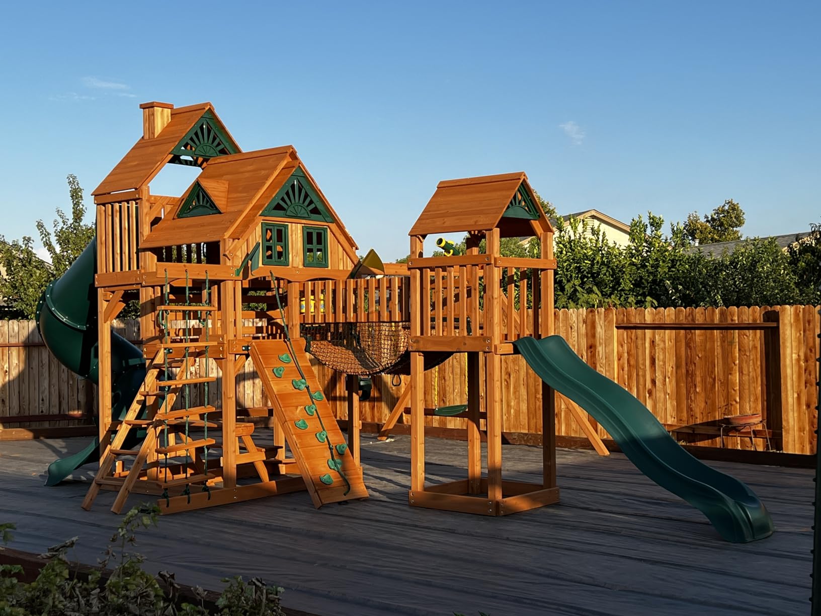 Gorilla Playsets 01-1037-AP Treasure Trove Treehouse Wood Swing Set with Tube Slide, Built-in Sandbox Area, and Clatter Bridge, Amber customer photo 1
