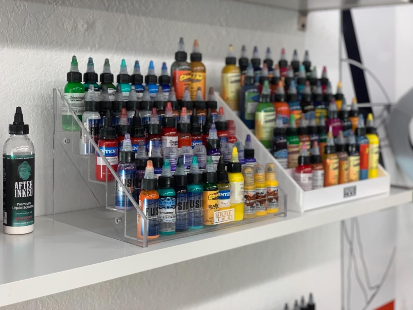 acrylic display stand organizer for tattoo inks, nail polish bottles and other beauty essentials that keeps them organized, secured and ready to use. customer photo 1