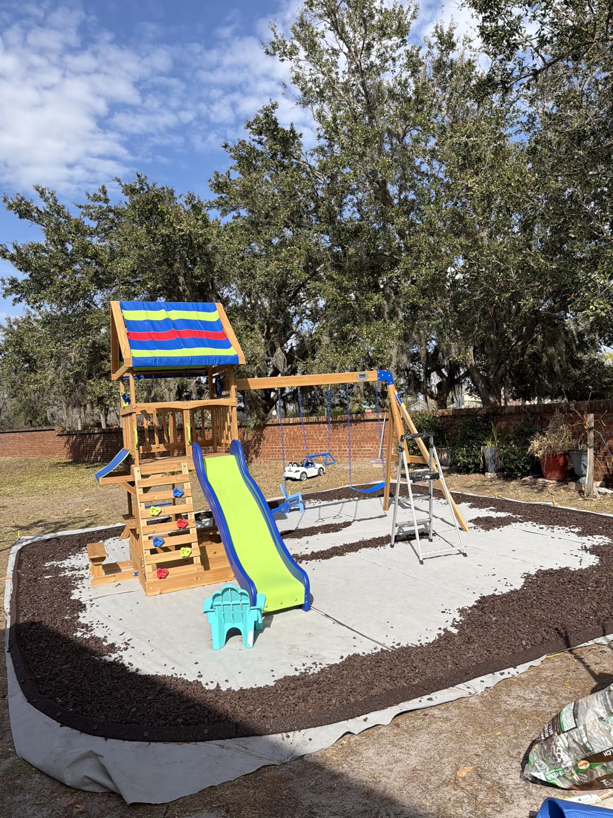 Backyard Discovery Beach Front Cedar Wood Swing Set with Wave Slide, Play Deck, Monkey Bars, Rock Wall Ladder, Shaded Picnic Area, Snack Bar, Belt Swings, Trapeze, Sandbox Area, Outdoor Playset customer photo 1