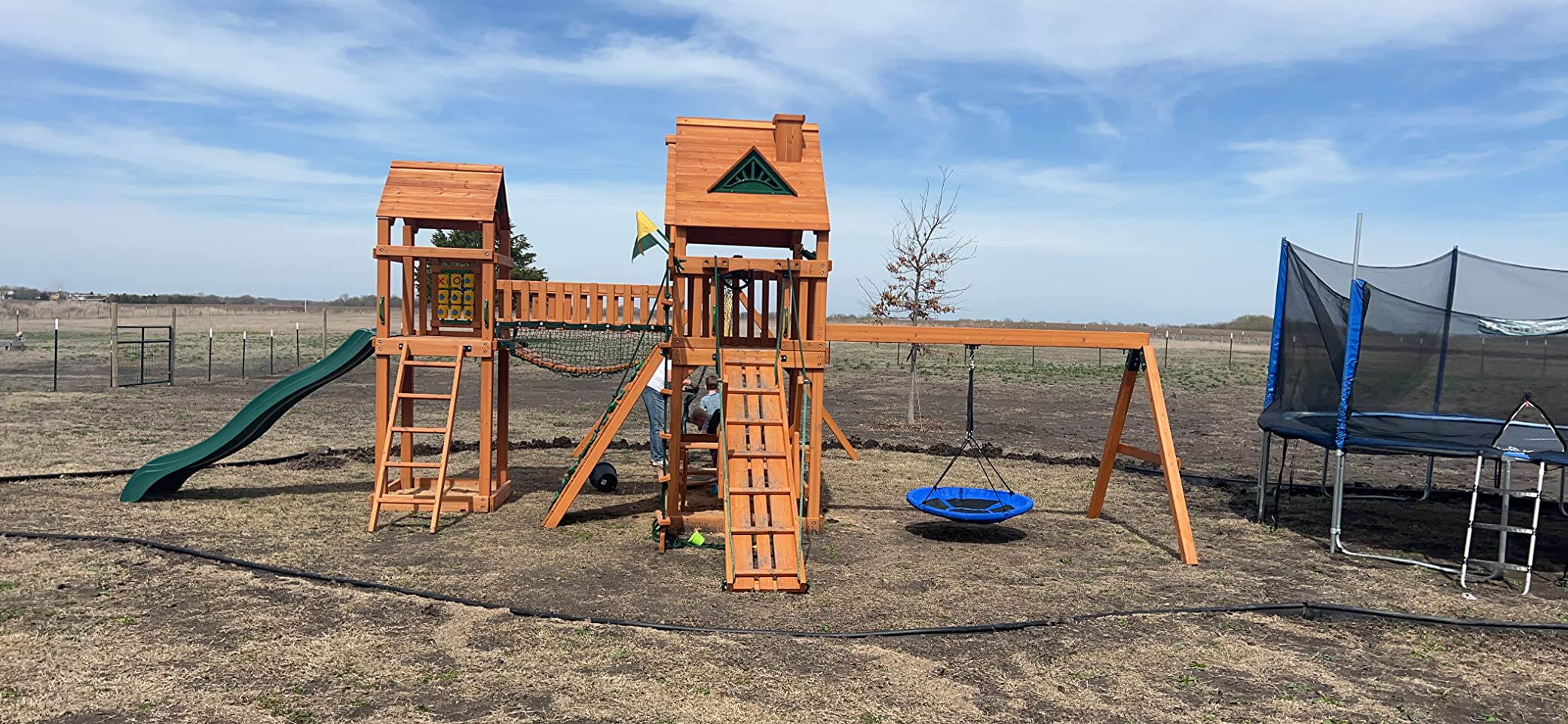 Gorilla Playsets 01-0055-AP Pioneer Peak Treehouse Wooden Swing Set with Amber Posts, Tire Swing, Slide and Tower with Clatter Bridge, Brown customer photo 2
