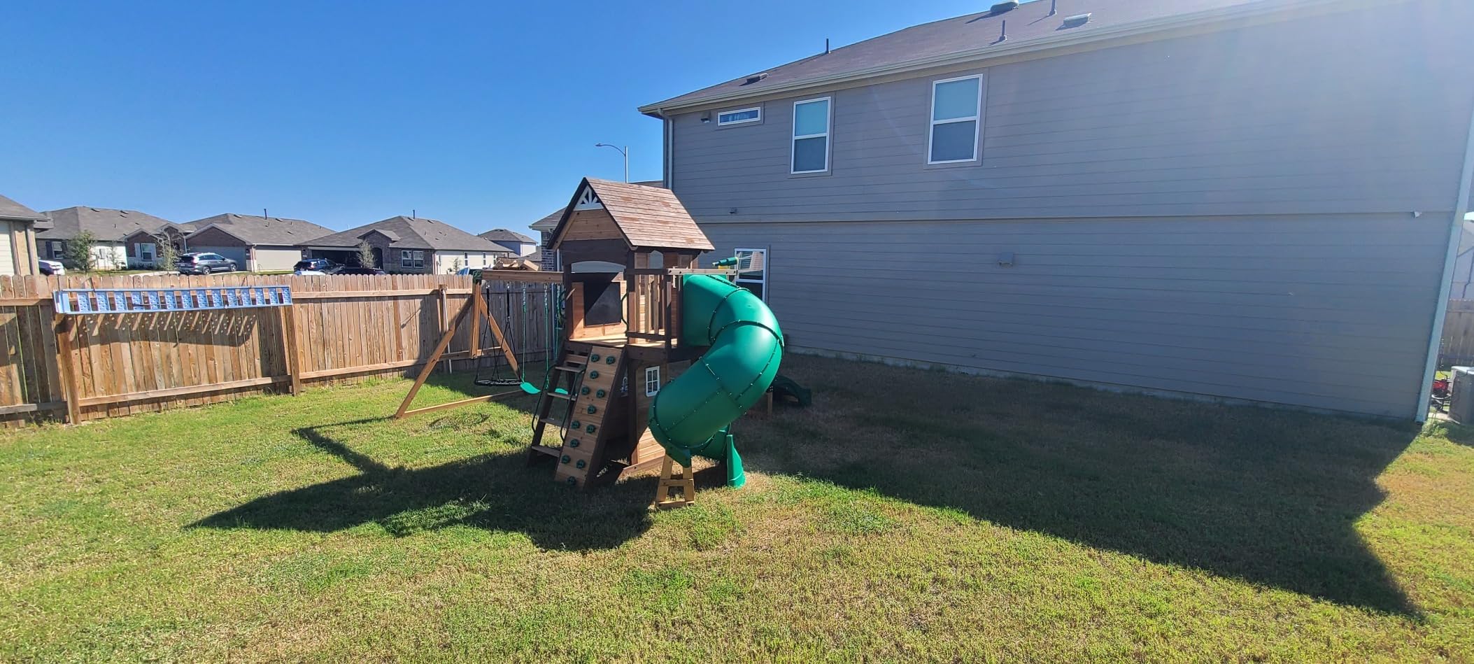 Backyard Discovery Cedar Cove Wood Swing Set with Spiral Tube and Wave Slide, Clubhouse, Toy Grill, Snack Bar, Rock Wall, Belt Swings, Web Swing, Balcony, Chalkboard, Ladder, Outdoor Playset customer photo 2