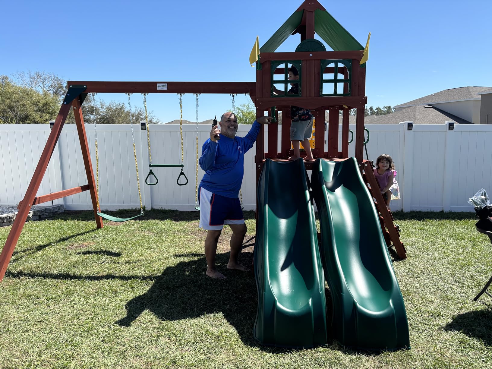 Gorilla Playsets 01-1057 Playmaker Deluxe Wooden Swing Set with Vinyl Canopy Roof, Dual Wave Slides, and Rock Climbing Wall, Redwood Stained Cedar customer photo 1
