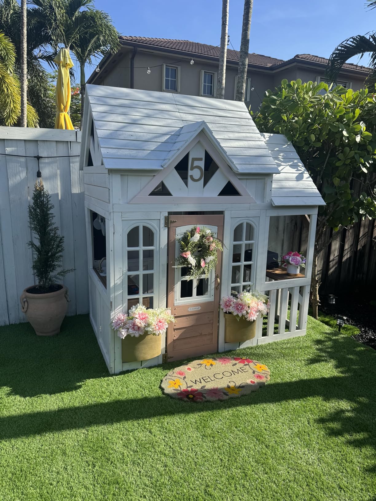 KidKraft Lantana Lane Outdoor Wooden Playhouse with Kitchen and Flap Door customer photo 1