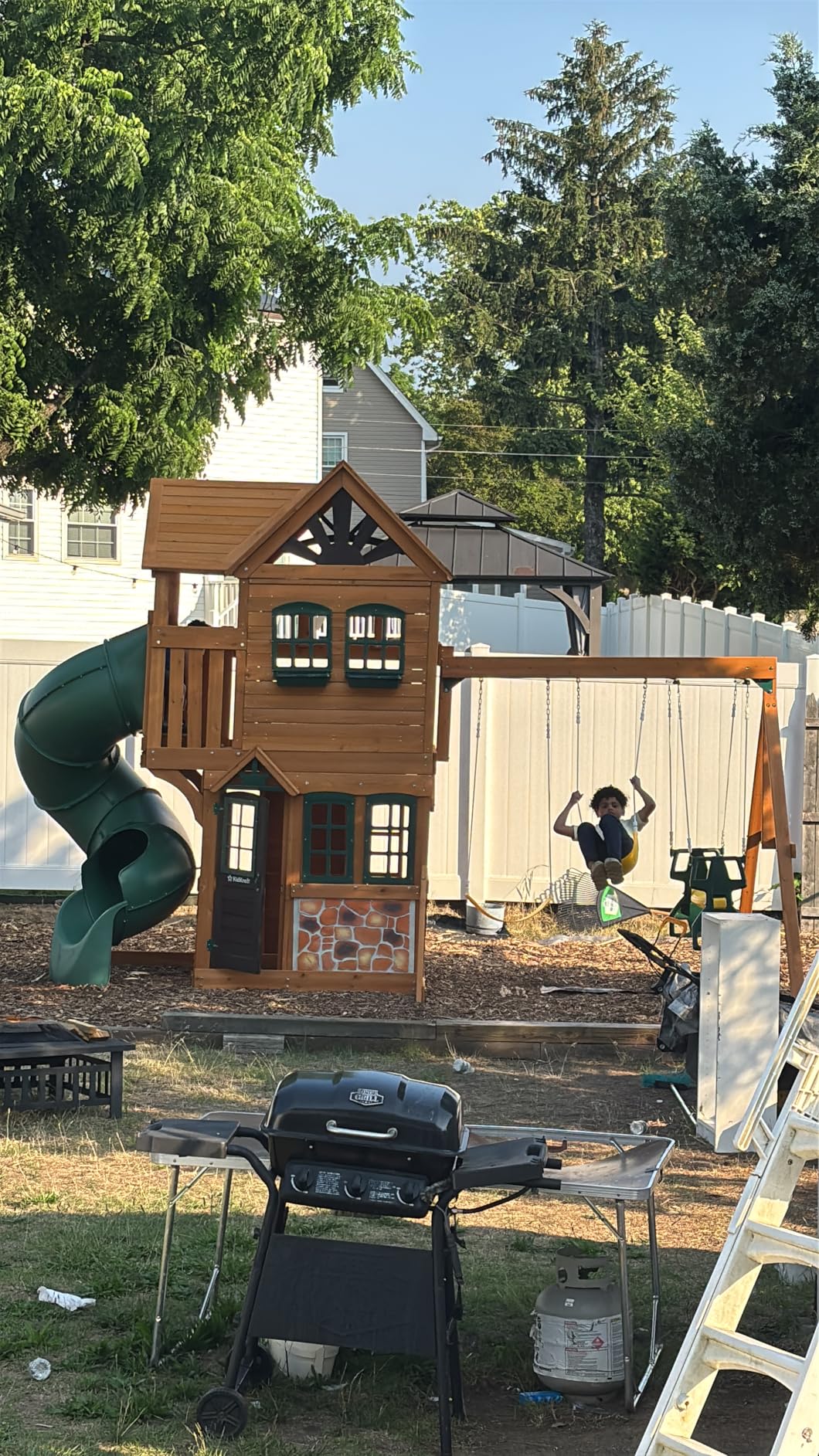 KidKraft Buffalo Crossing Wooden Swing Set with Playhouse, Rock Wall, Tube Slide and Glider customer photo 1