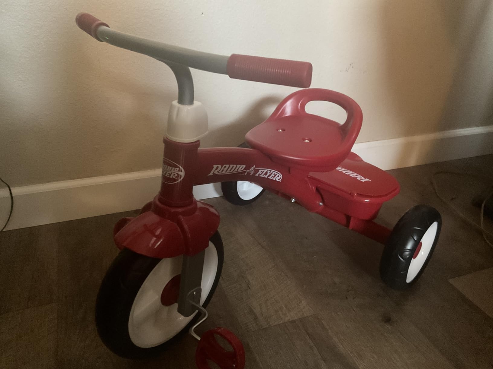 Radio Flyer Red Rider Trike, for Ages 2.5-5, Adjustable Seat, Steel Construction, Quiet Ride Wheels, Covered Storage Bin, Comfort Grip Handlebars, Easy Carry Seat Handle, Tricycle for Toddlers customer photo 1