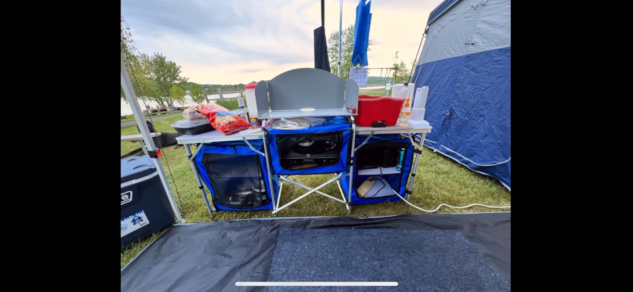 Outsunny Camping Kitchen Table, Portable Folding Camp Kitchen, Aluminum Cook Station with 3 Fabric Cupboards, Windshield, Carrying Bag for BBQ, RV, Picnic, Black customer photo 2