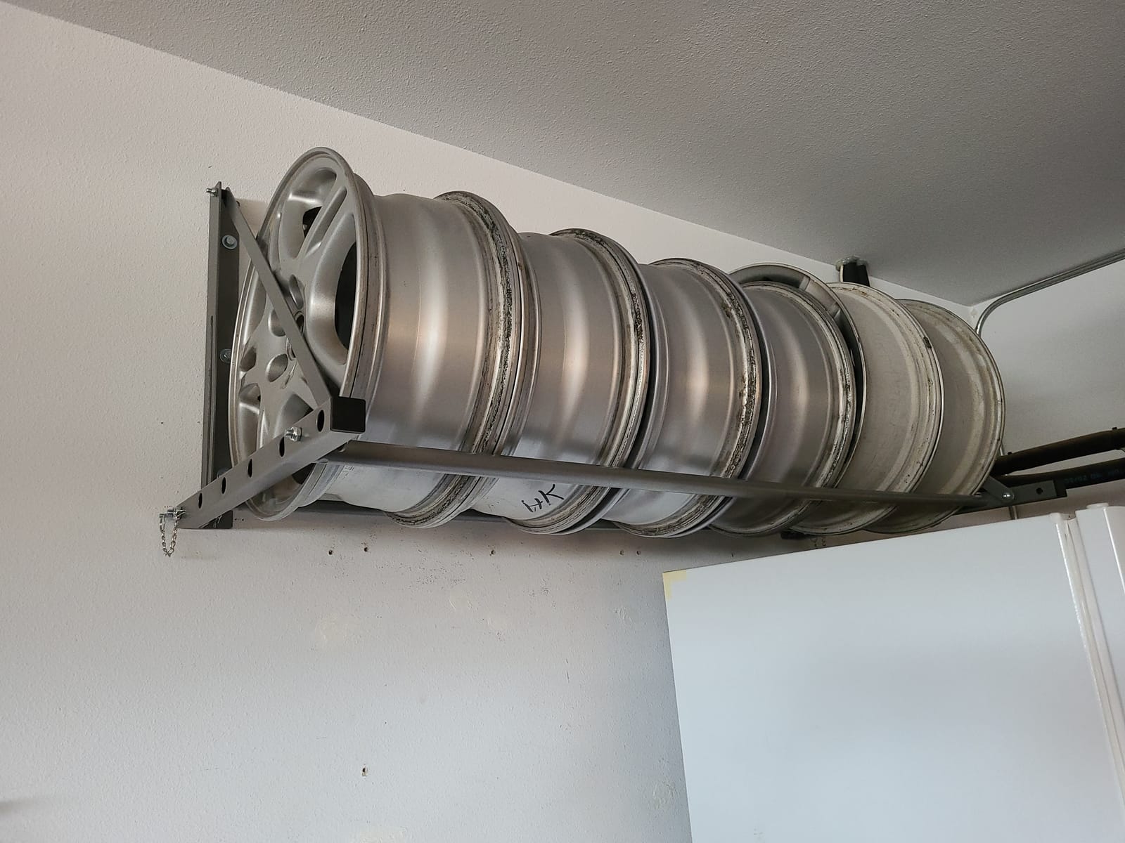 MaxxHaul Adjustable Wall Mount Folding Tire Rack - 32 to 48 Inch Width - 300 lb Capacity - Heavy Duty Steel Garage Tire Storage Holds 4 Tires - 70489 customer photo 1