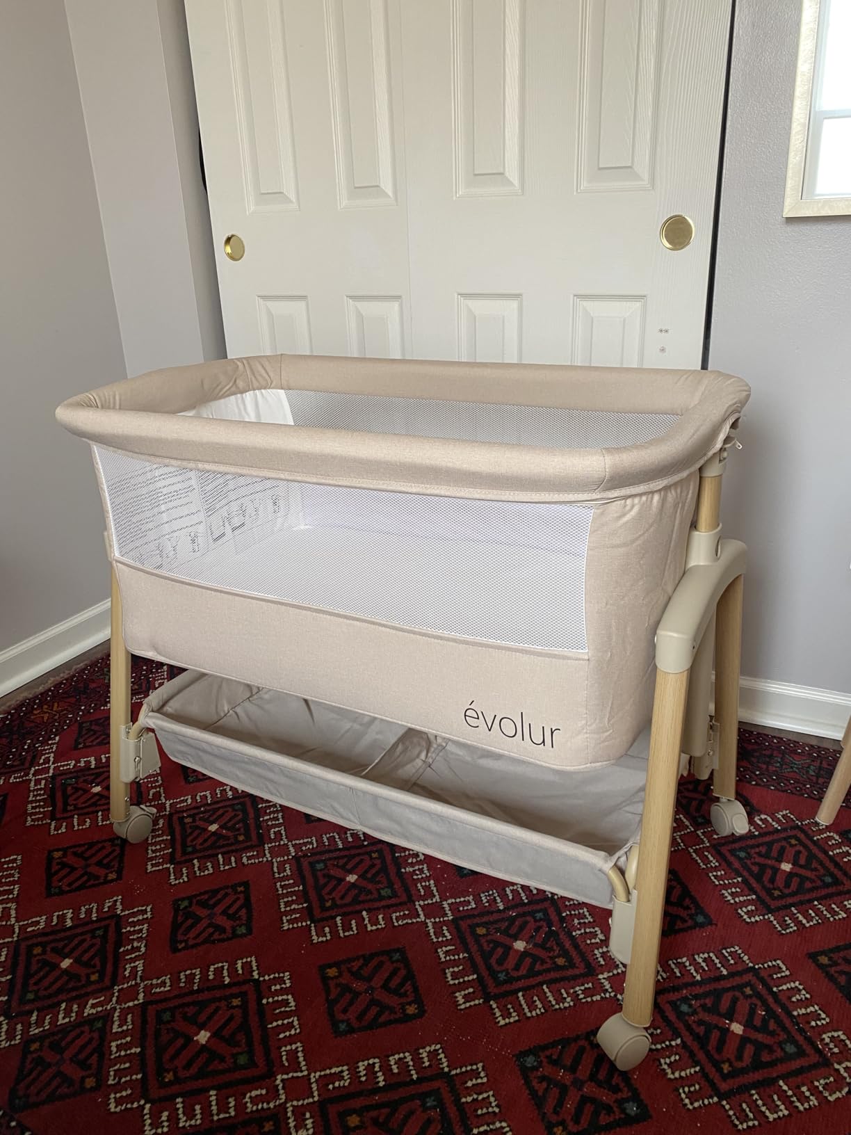 Evolur Lullaby Portable Bassinet with Wheels, Adjustable Bedside Sleeper, Breathable Mesh Sides, Large Storage Basket, Easy Fold, and Travel Bag Included - Light Gray customer photo 1