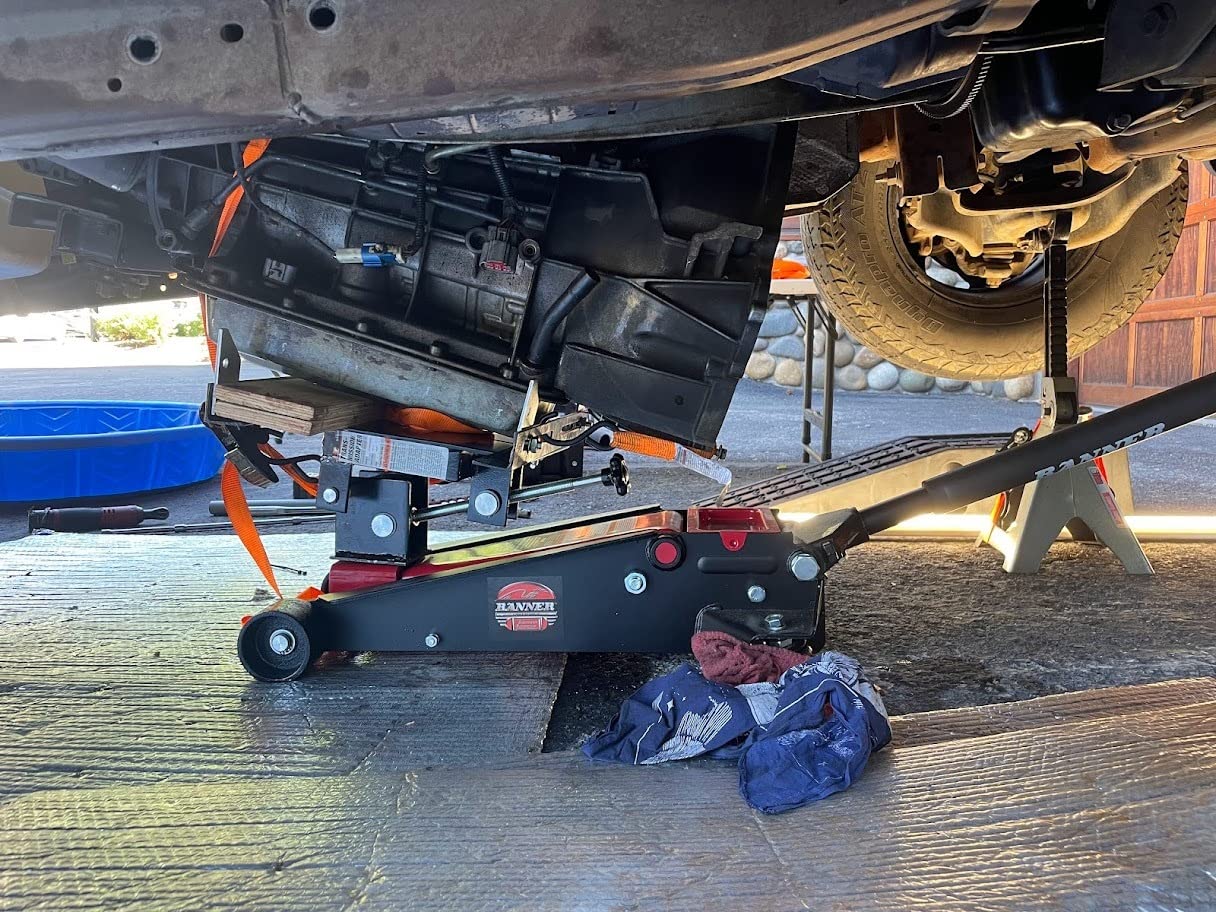 Performance Tool W41044 300 lbs. Floor Jack Transmission Jack Adapter | Converts floor jacks. Fits 1-5/32 and 15/16 inch saddle shafts. Tilts forward and back. Includes safety chain customer photo 1