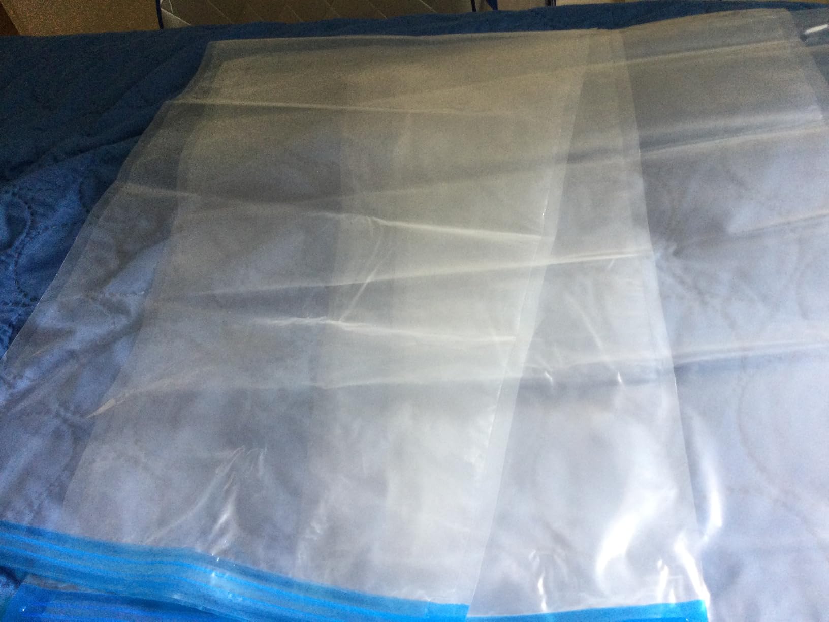 Amazon Basics Vacuum Storage Bags with Hand Pump for Travel, Space Saving Compression Bags for Clothes and Blankets, Clear, 12 Pack (3 Small, 3 Medium, 3 Large & 3 Jumbo) customer photo 1