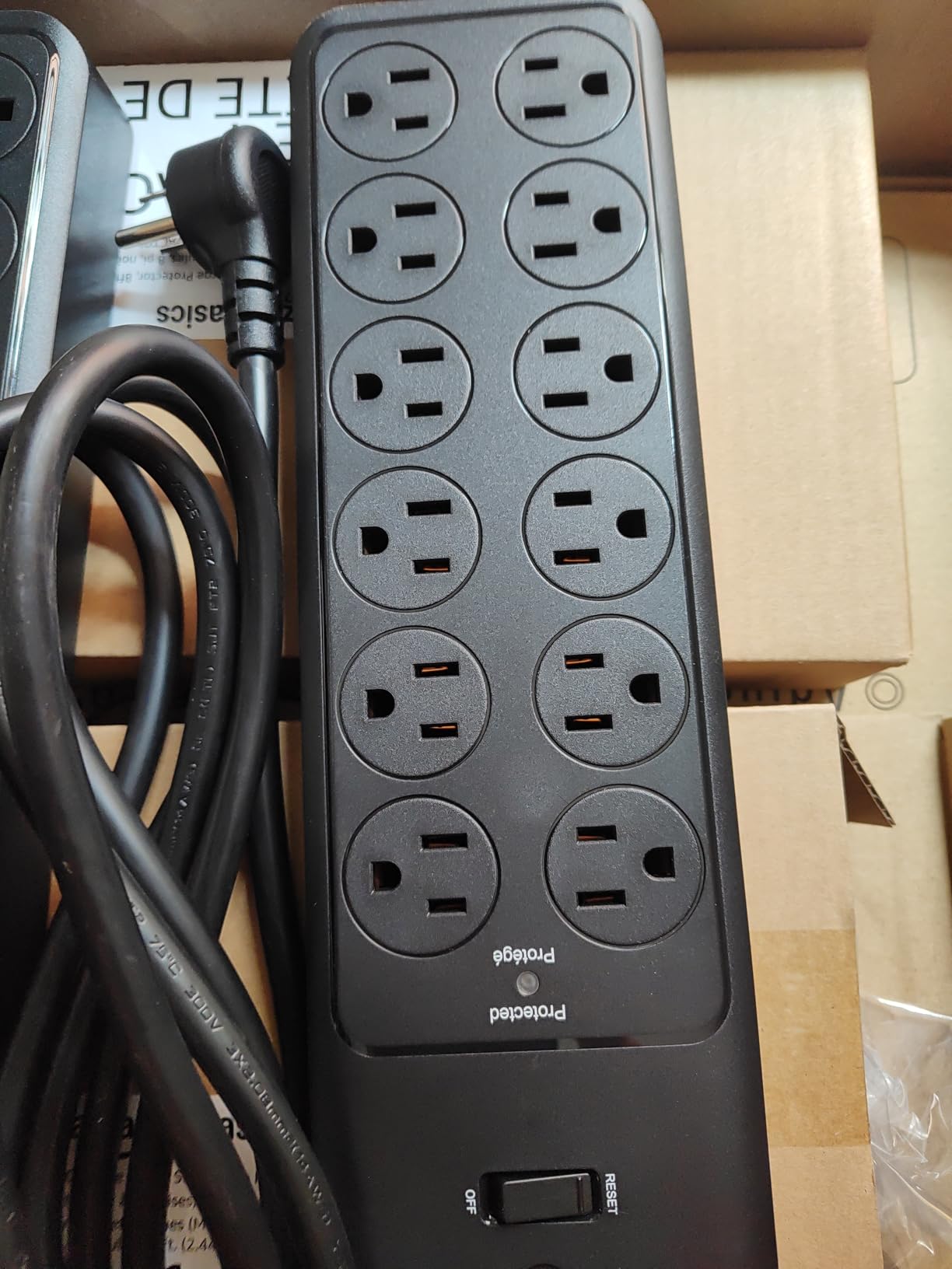Amazon Basics 12-Outlet Surge Protector Power Strip, 4000 Joules, 8ft Extension Cord, Rectangle, for Home, Office, Gaming Room, Black customer photo 1