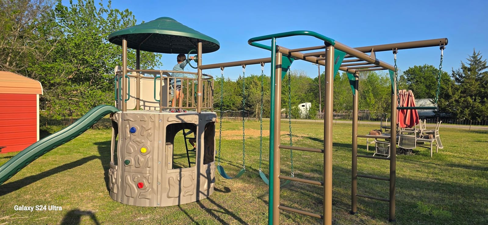 Lifetime Adventure Tower Deluxe Swing Set Playset Lifetime Adventure Tower, Covered Clubhouse, 9 ft Wavy Slide, Monkey Bars, Climbing Wall, Fireman’s Pole, Belt Swings & Trapeze customer photo 2